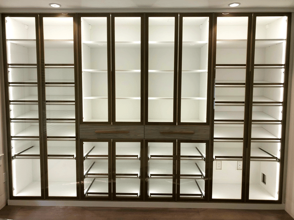 Wall unit with glass doors and pull out trays inside