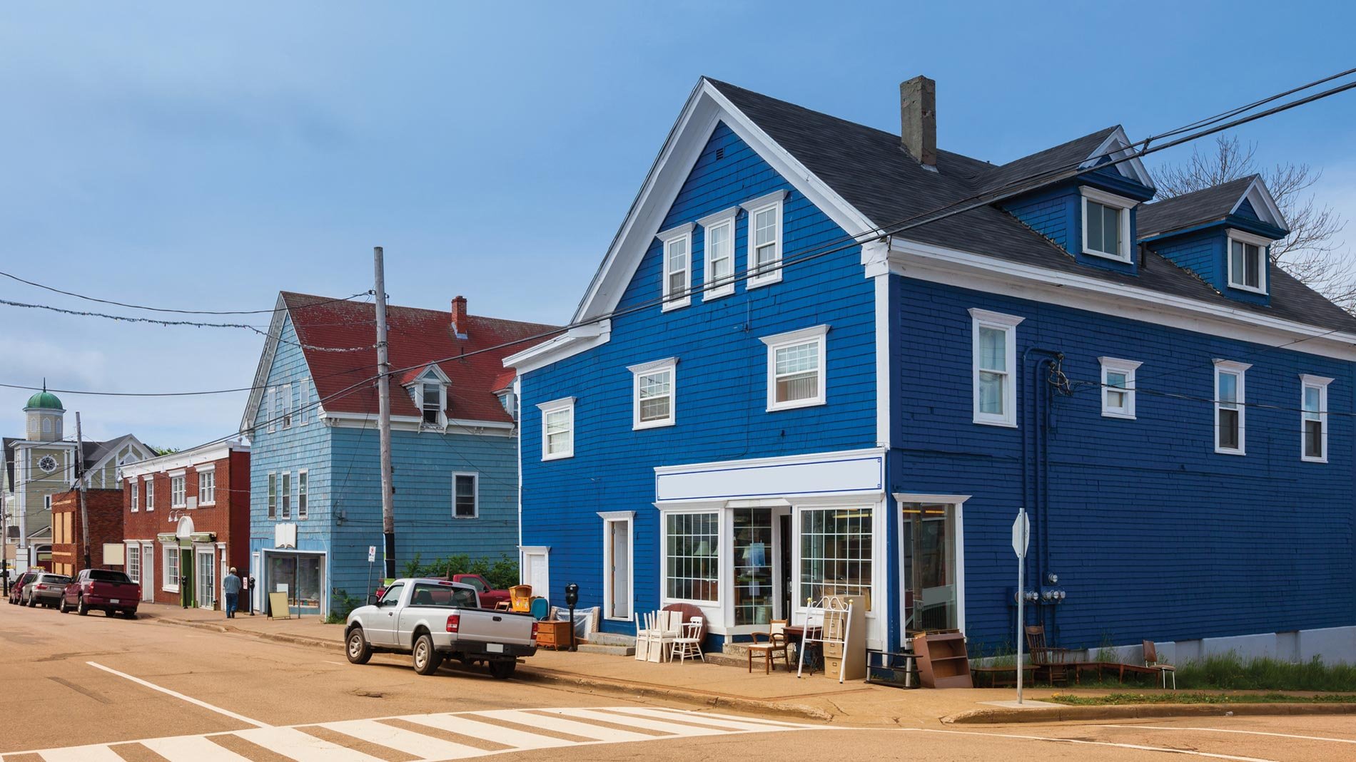 Daytime streetview of clapboard houses in Sydney, Nova Scotia.