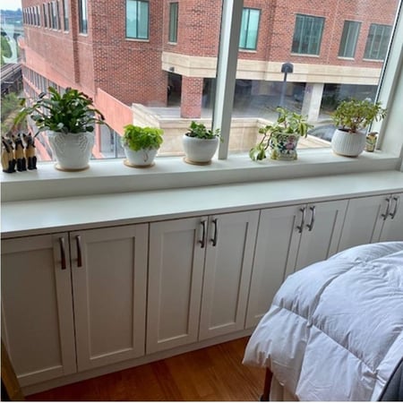 Richmond - Custom closets - Built-in floor cabinets under a window sill