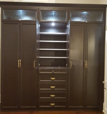 Brown wardrobe closet with drawers California Closets Pensacola and Panama City, Florida