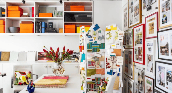 California Closets New York City Custom Commercial Space White Office Custom Bookshelves Storage Interior Design Studio with Closed Cabinets and two desk workspaces