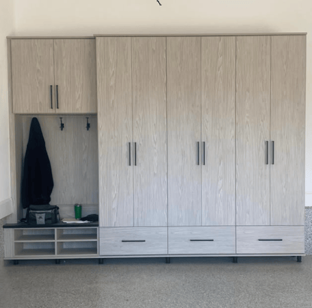 Light grey toned garage storage cabinets designed by California Closets Greenwich, Connecticut