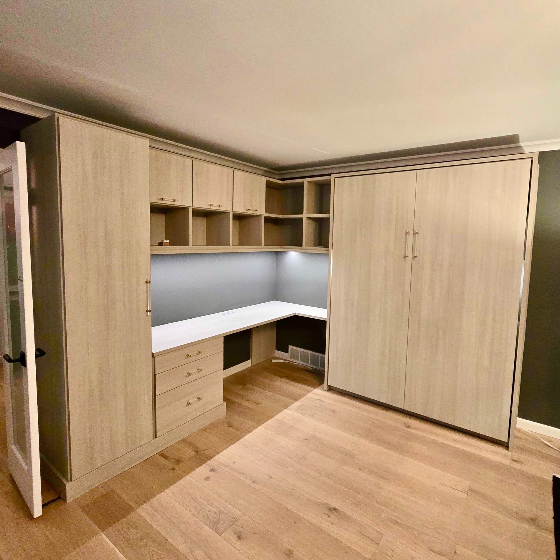 Wall bed with doors and shelves