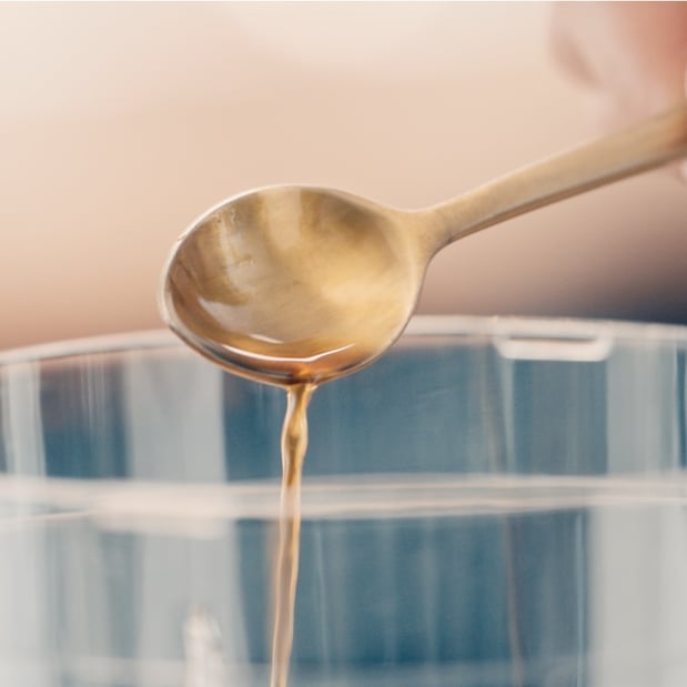 pouring honey into blender