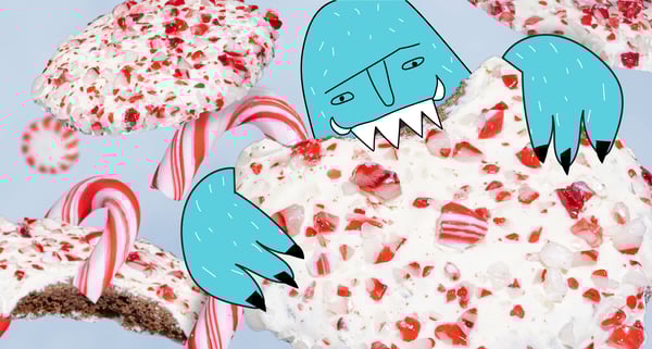 A blue yeti takes a bite out of a new MOD Pizza's new choloate peppermint cookie dessert with candycanes in the background.