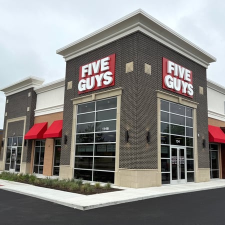 Exterior photograph of the Five Guys restaurant at 1146 North Emerson Avenue in Greenwood, Indiana.