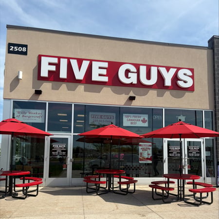 Exterior photograph of the Five Guys restaurant in Oakville, Ontario, Canada.