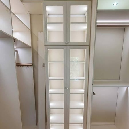 Greensboro - Custom closets - Floor-to-ceiling glass cabinets with display shelves in walk-in closet