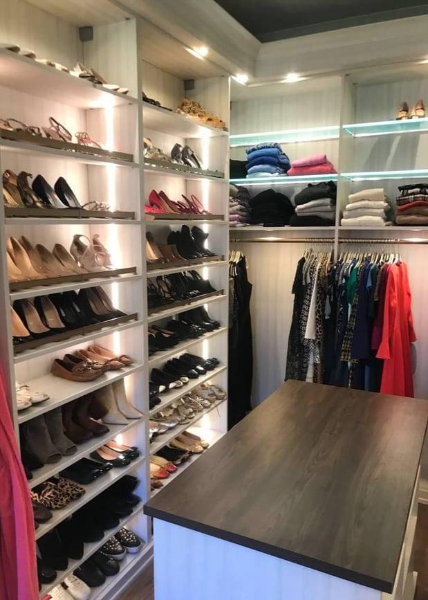 Greensboro - Custom closets - Beautiful walk-in closet with shoe racks, storage shelves, a center island, and LED lights