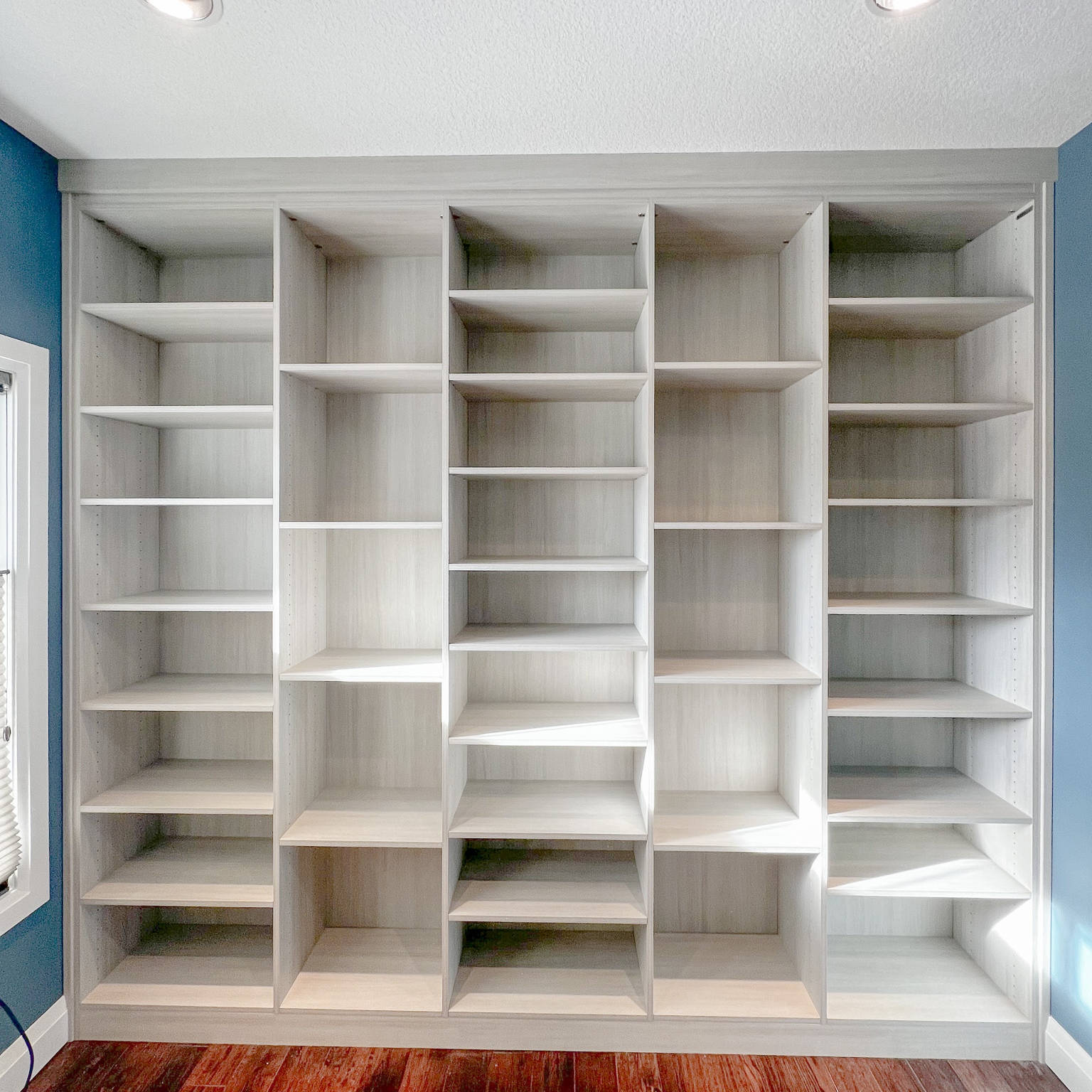 Floor to ceiling adjustable shelving, perfect for any book lover.