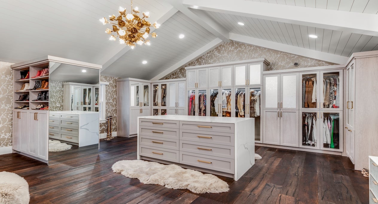 Custom walk in closet design with closet systems, storage solutions, and built-in cabinets for organized luxury storage in Bloomfield Hills, Michigan