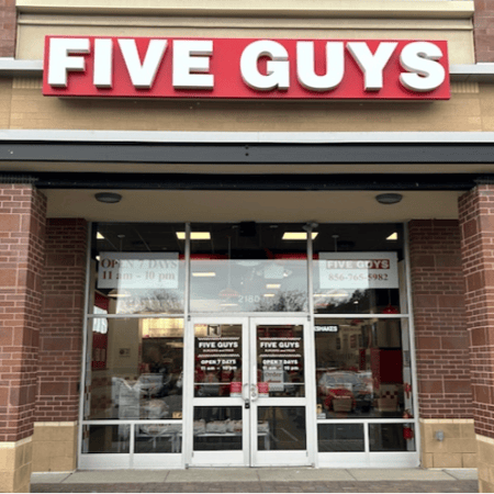 Exterior photograph of the Five Guys restaurant at 2180 N. 2nd Street in Millville, New Jersey.