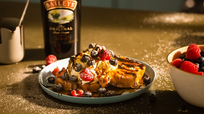 French Toast with Baileys Irish cream, cranberries, raspberries, and icing sugar on top