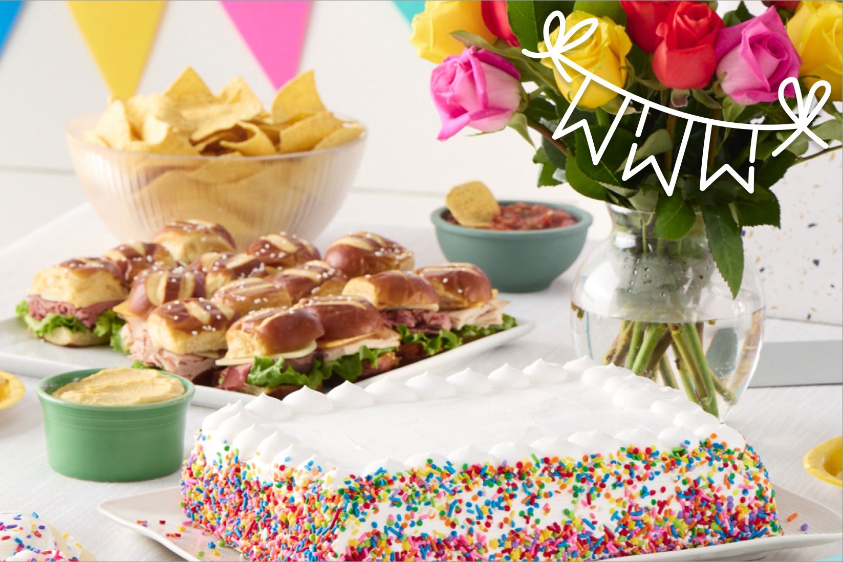 party cakes sandwich trays and flowers