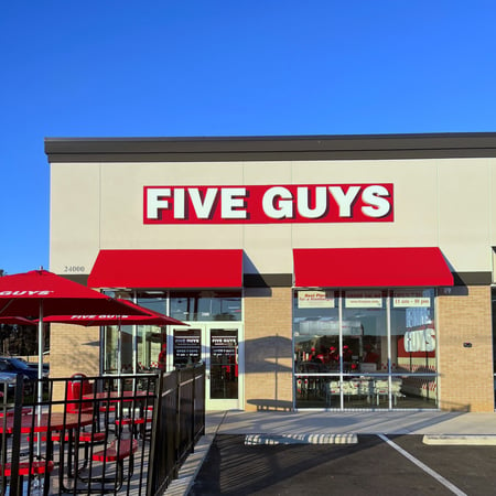 Exterior photograph of the Five Guys restaurant at 23992 US Highway 80 East in Statesboro, Georgia.