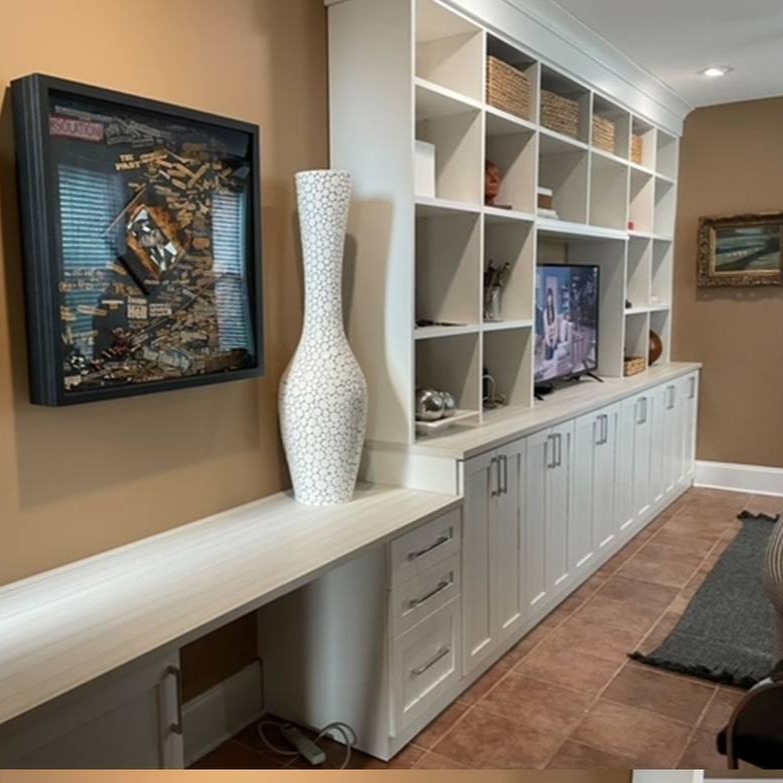Richmond - Custom closets - Living room entertainment center with cabinets connected to a Desk with drawers