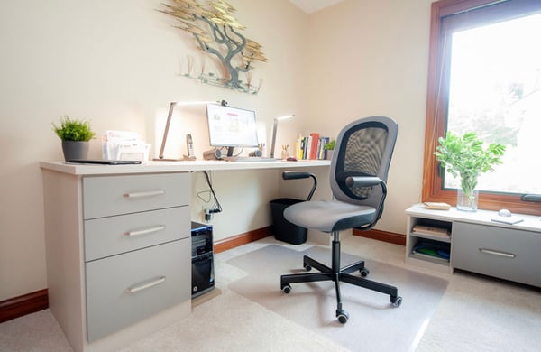 Home office with storage cabinets in light gray by California Closets Cleveland, Ohio.