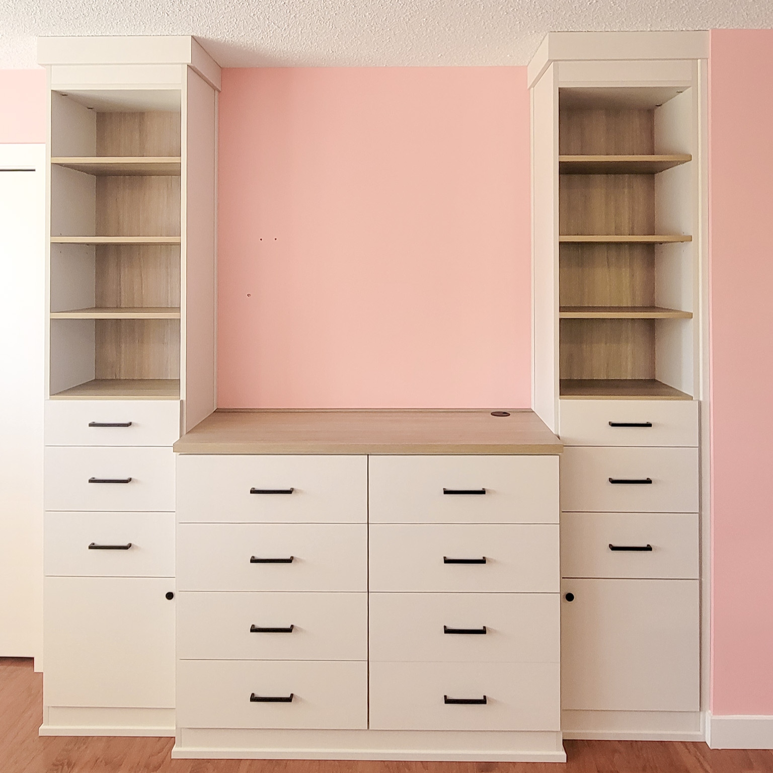 Bedroom media centre with lower drawers and upper shelving.