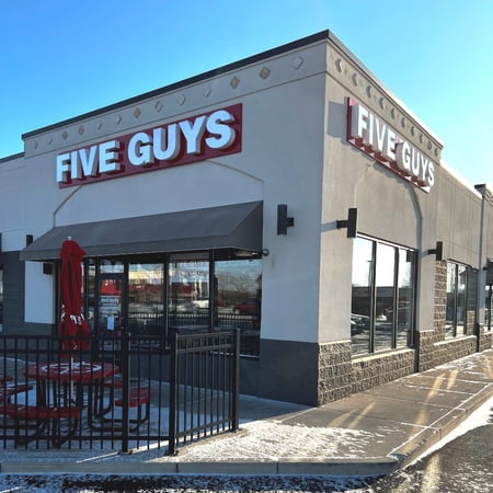Exterior photograph of the Five Guys restaurant at 1395 Conant Street in Maumee, Ohio.