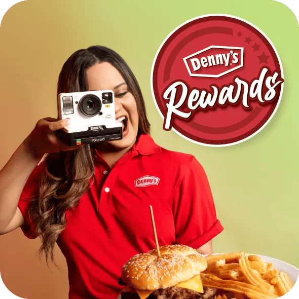 Dennys woman taking picture of a tasty looking burger