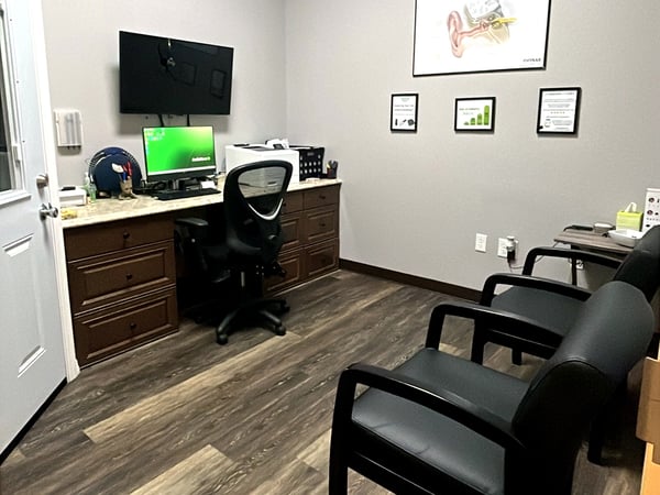 Interior photo of the consultation office in the AudioNova hearing clinic in Leesburg, FL on Highway 27