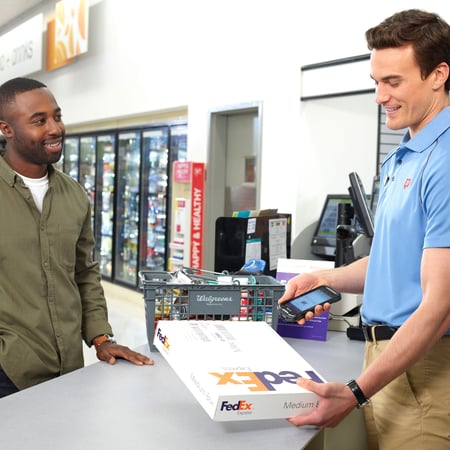 customer dropping off FedEx package at Walgreens