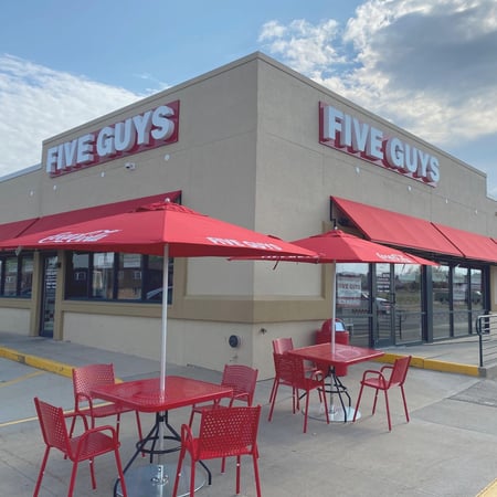 Exterior photograph of the Five Guys restaurant at 6406 University Avenue in Cedar Falls, Iowa.