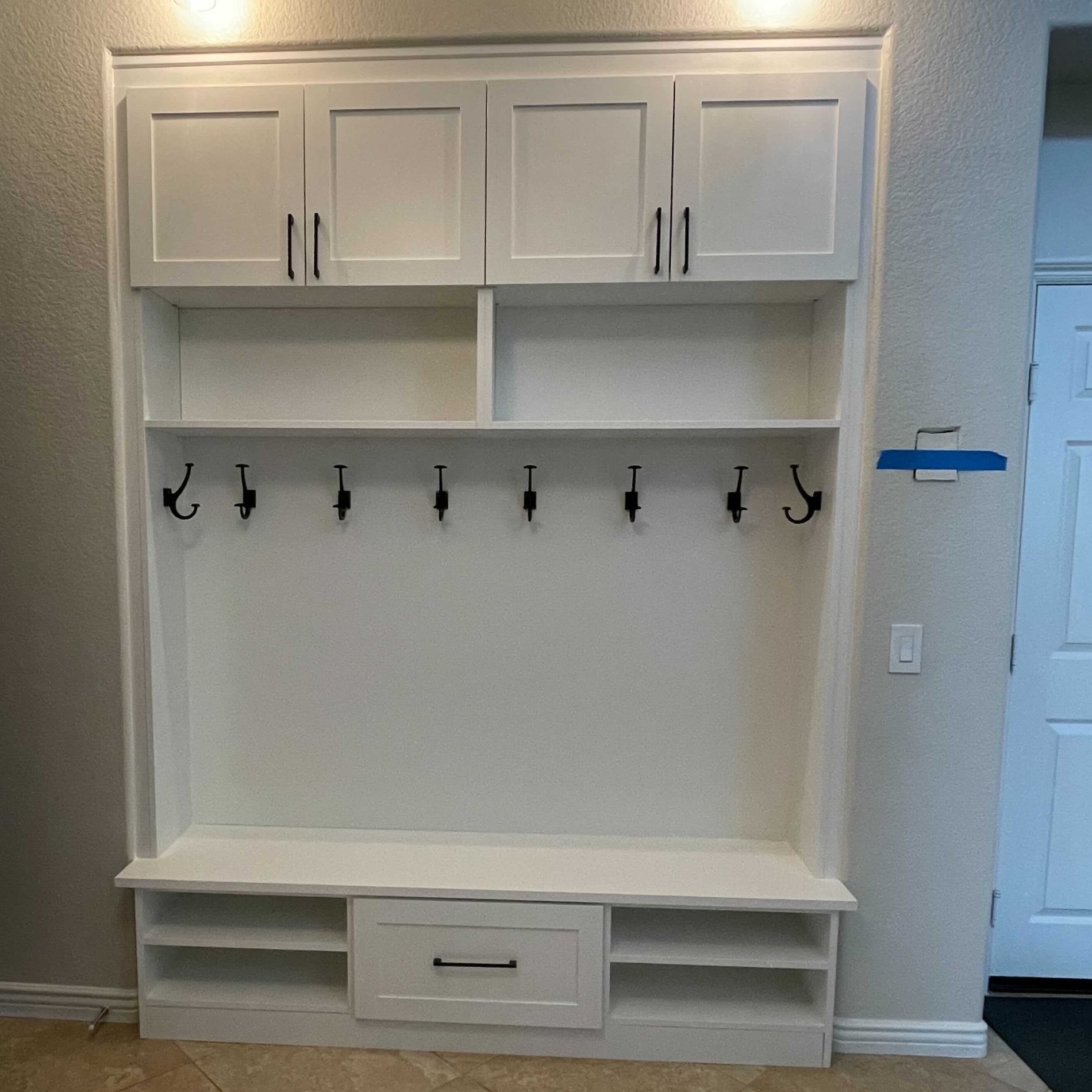Custom entry closet for coats and bags.