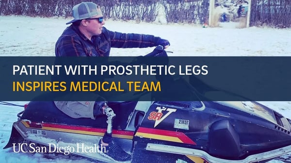 Image of Tanner Hopson riding snowmobile, UC San Diego Health patient with prosthetic legs