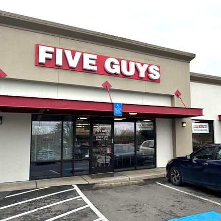 Exterior photograph of the Five Guys restaurant at 3266 Gateway Boulevard in Springfield, Oregon.