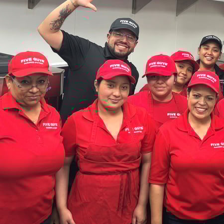 Crew members pose for a photograph ahead of the opening of the Five Guys cloud kitchen at 90 Charter Oak in San Francisco, California.