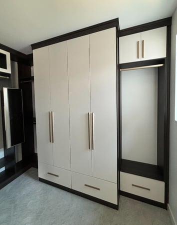 Custom designed and built walk in closet by California Closets San Diego, California.