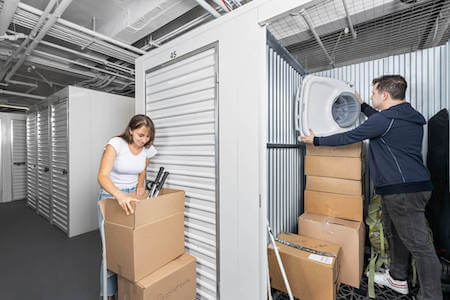 Couple packs their storage unit with tennis rackets, baby stuff and more
