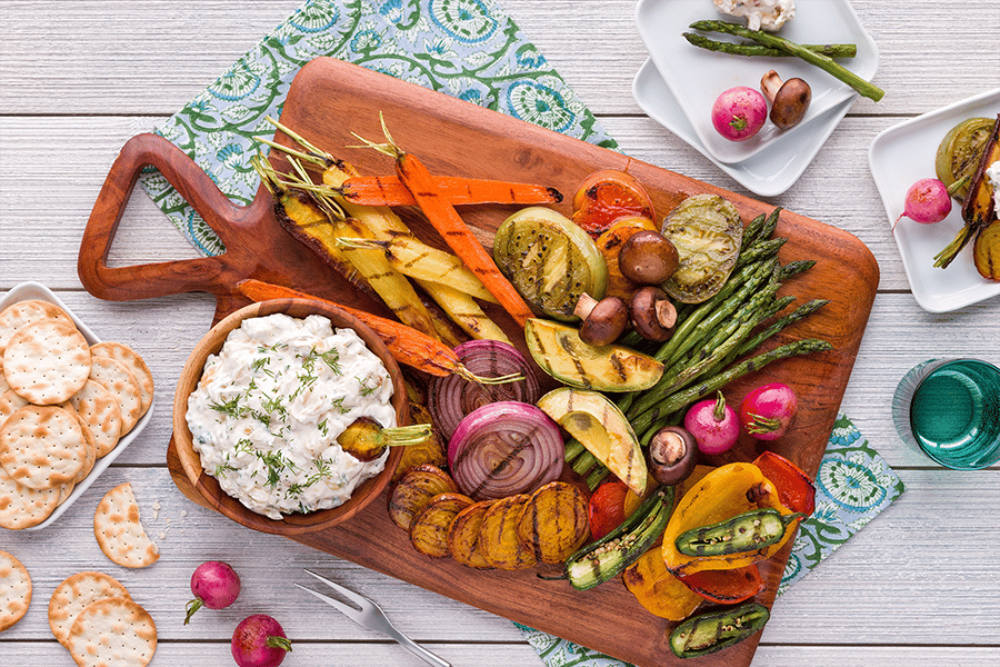 grilled vegetables and sides on a cutting board