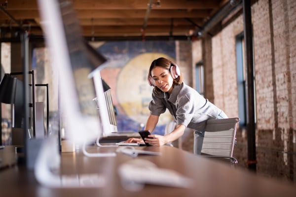 Woman working with computer and headphones