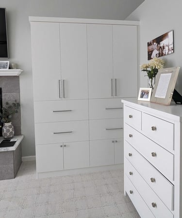 White Cabinetry wardrobe style closet by California Closets San Diego.