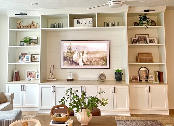 Entertainment Center with shelving and cabinets for displaying decor by California Closets Cleveland, Ohio.