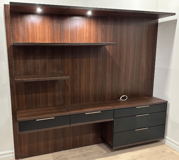 California Closets New York custom virtuoso home office brown desk with black drawers and gold hardware