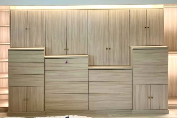 Custom Cassini Beach office with gold hardware and built-in lighting.