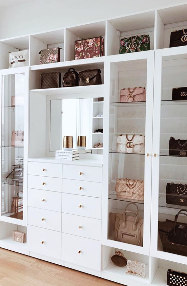Img 8 -Bag wall display. white closet doors with glass shelving and gold handles and drawer knobs