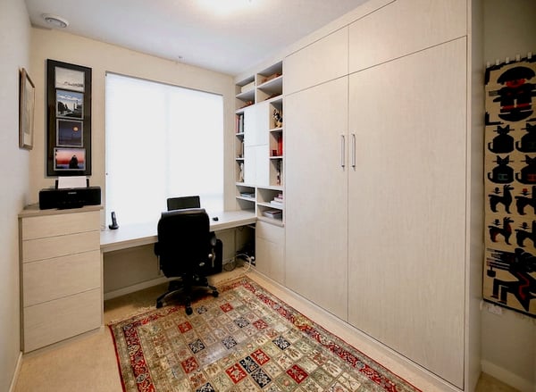 Murphy Bed storage with custom cabinets, drawers, and wire baskets by California Closets Greater Detroit, Michigan.