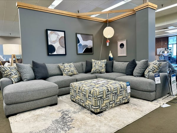Shop our chic grey sectional collection at Slumberland Furniture in Burlington, IA. Ideal for modern living rooms and ultimate relaxation.