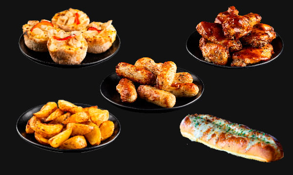 Plates with Chicken Wings, Cheese and Garlic Bread, Chicken Cocktail Sausages, Potato Wedges, and POP-ITZ®.