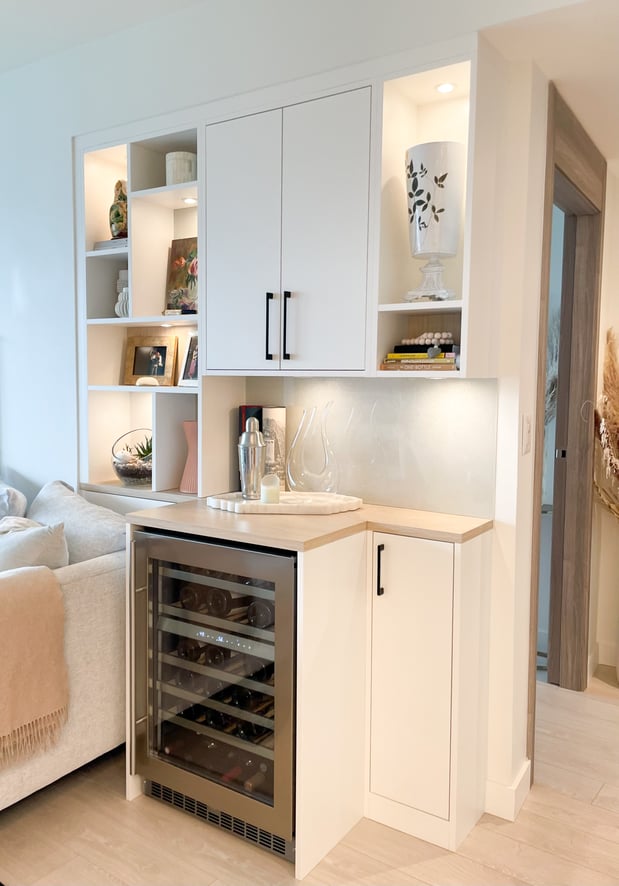 Wine bar with additional shelving for decor and a countertop above the wine fridge