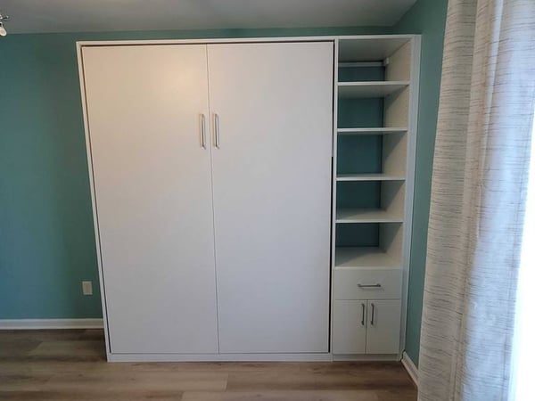 A white wardrobe with neatly arranged shelving.