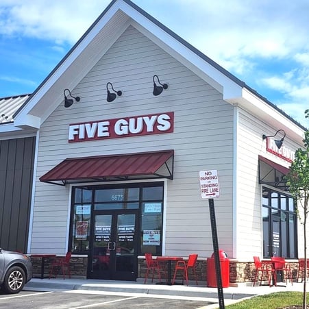 An exterior photograph of the Five Guys restaurant in Haymarket, Virginia.