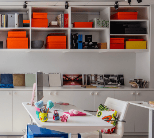 Img 4 California Closets New York, NY Custom Commercial Space White Office Custom Bookshelves Storage Interior Design Studio with Closed Cabinets and two desk workspaces