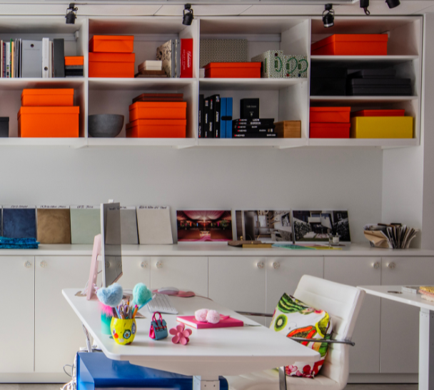 Img 4 California Closets New York, NY Custom Commercial Space White Office Custom Bookshelves Storage Interior Design Studio with Closed Cabinets and two desk workspaces