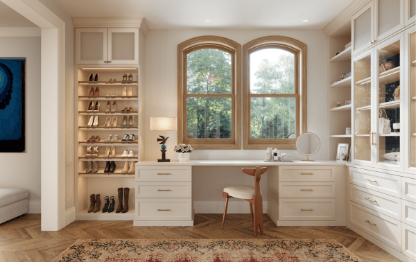 Custom Walk-In Closet Dressing Room with Built-In Vanity Desk Shoe Shelving Display Light Wood Cabinetry Drawer Storage by California Closets South Palm Beach Florida