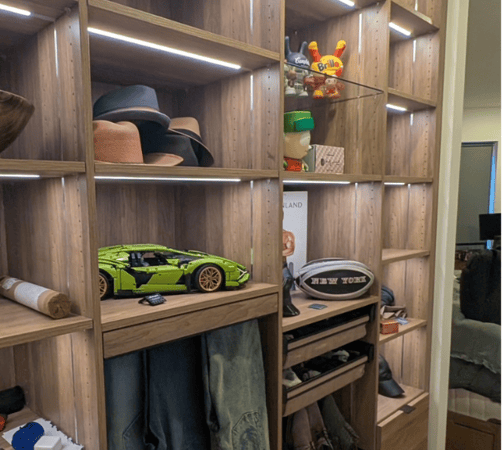 California Closets Nassau County NY Long Island Custom Walk in Closet Dark wood with glass shelving LED strip lights custom basket drawers for storage pants organizer shoe organizer custom drawers